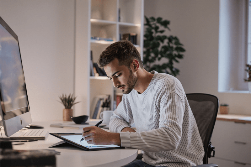 A graphic designer working at a desk