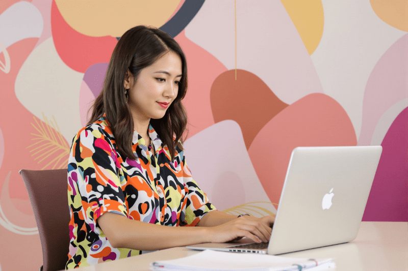 Woman working in a colorful office