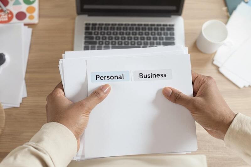 person holding a paper with the words 