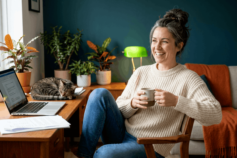 solo-business-owner-home-desk-celebration